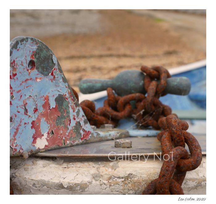 FIND PHOTOGRAPH OF RUSTY CHAINS ON A BOAT FOR SALE
