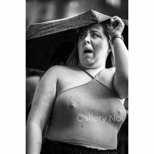 FIND STREET PHOTOGRAPH OF GIRL IN RAIN UNDER UMBRELLA